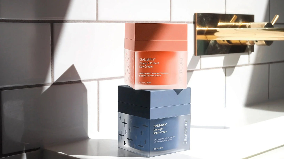 GoLightly day cream stacked on GoNightly night cream on a sunlit bathroom bench