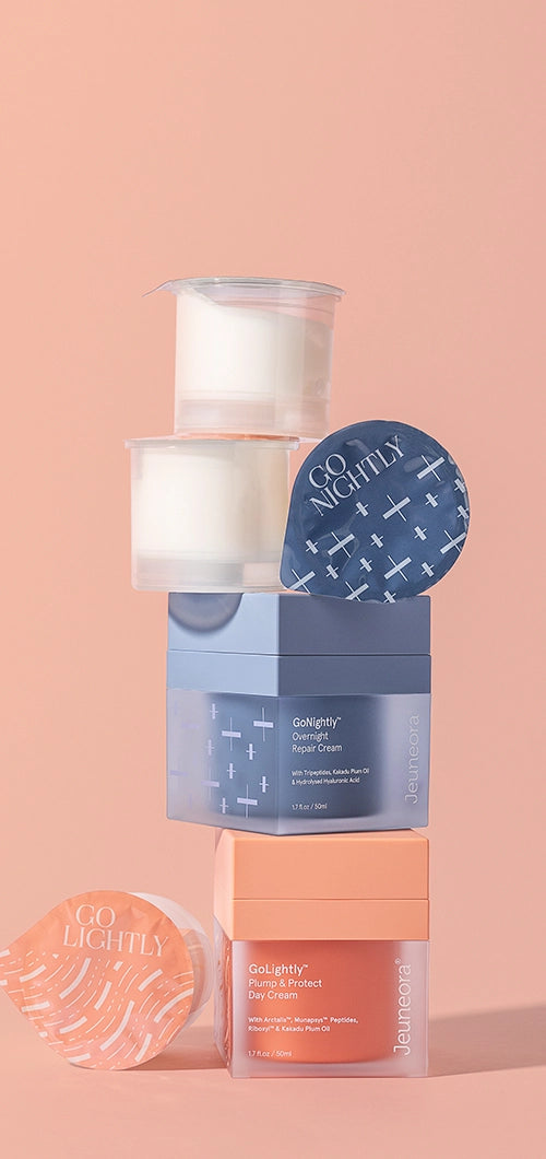 Jeuneora GoNightly and GoLightly Day & Night Duo with refill pods stacked on a peach background