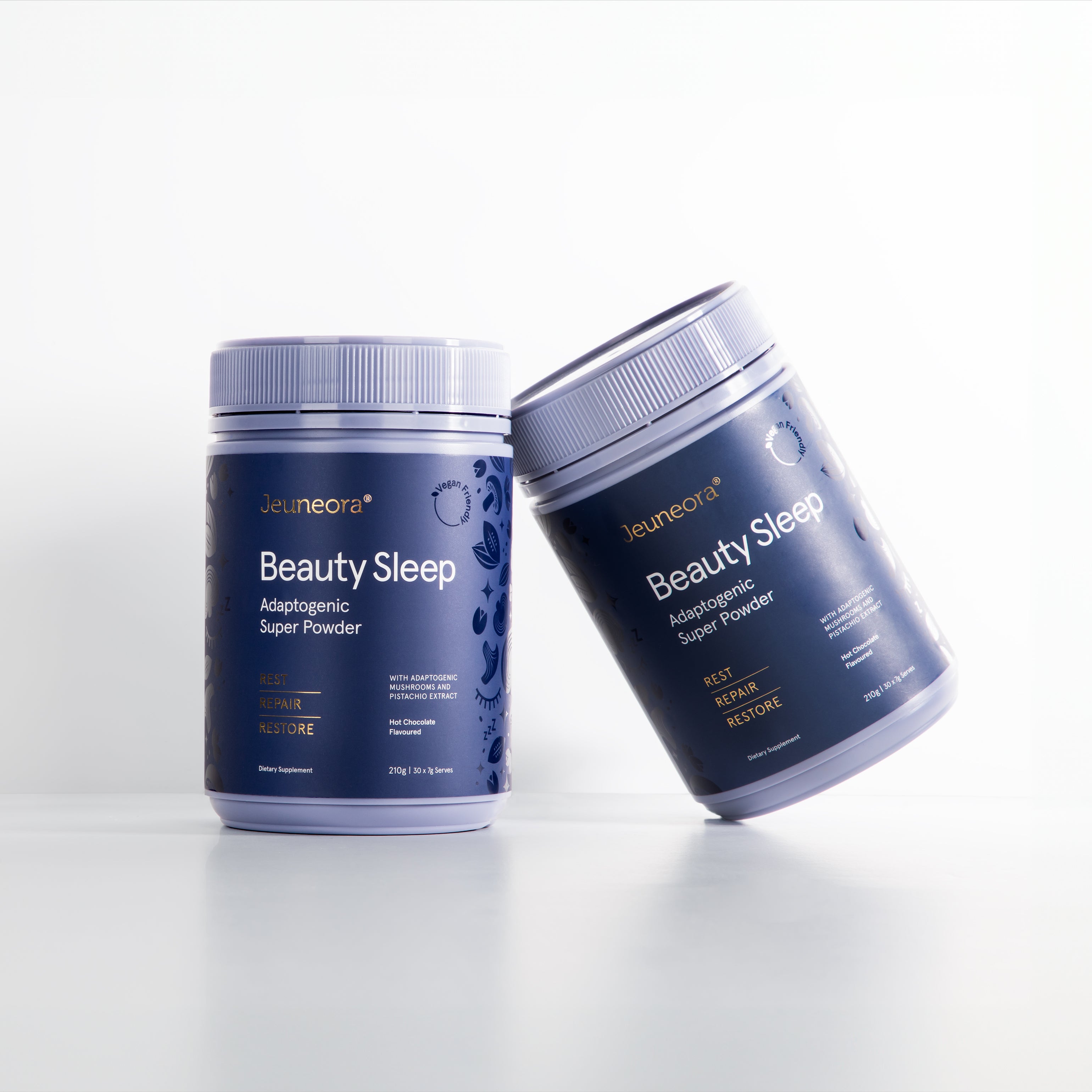 Two Jeuneora Beauty Sleep pottles on a bright white background, one leaning against the other