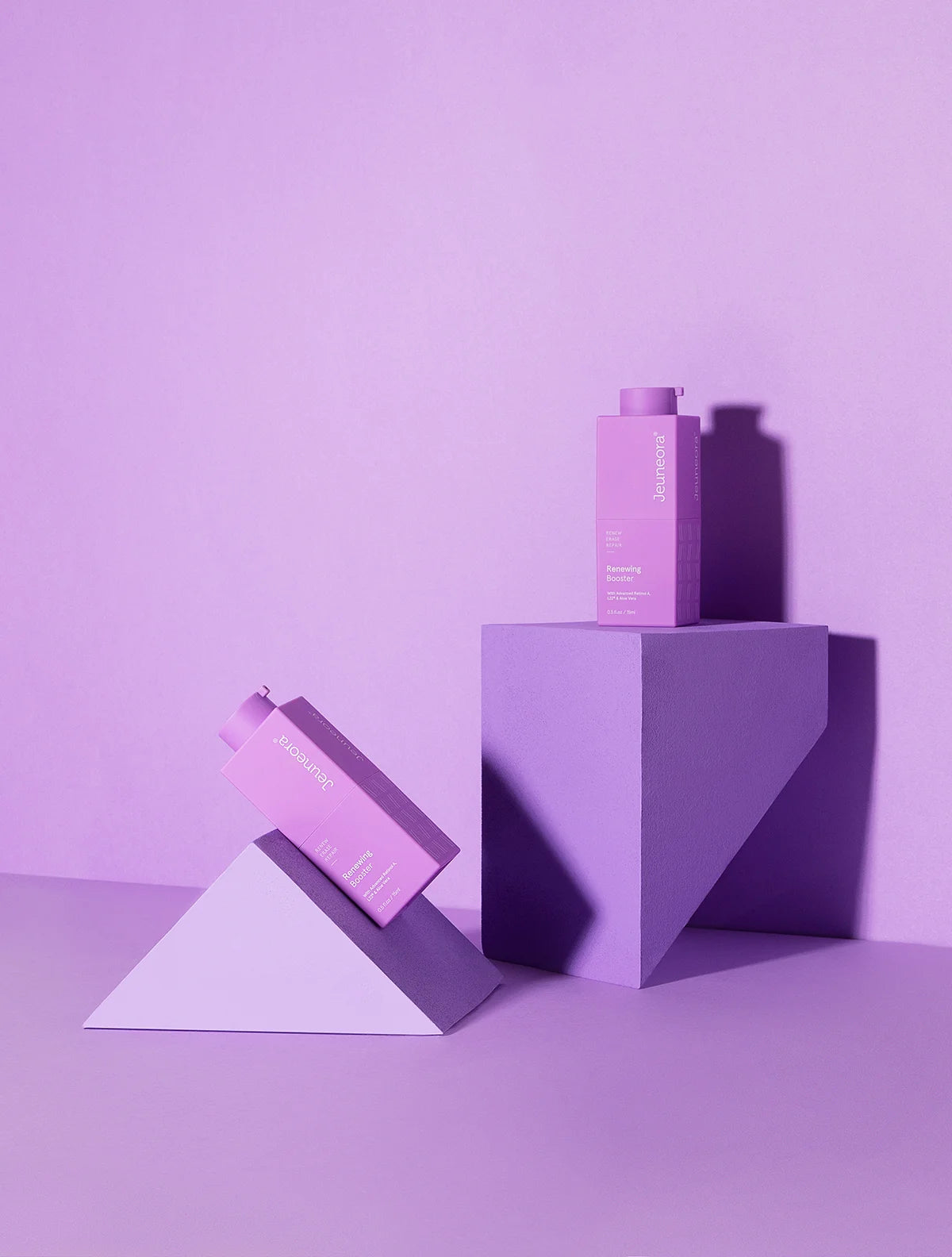 Renewing Booster Advanced Retinol Serum on purple background