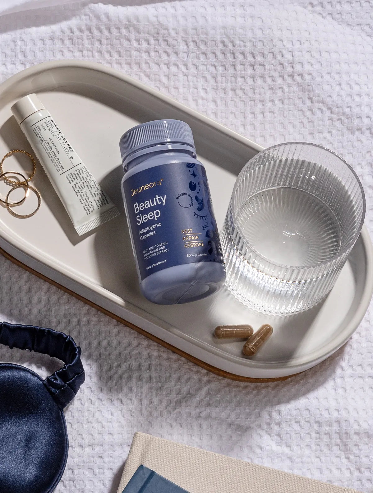 Jeuneora-Beauty-Sleep-Capsules layout on bedside table for evening routine