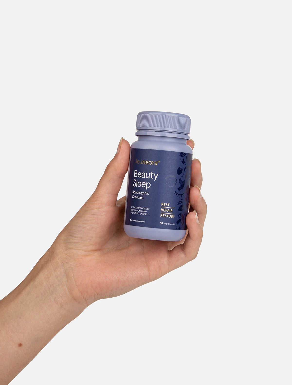 Hand holding Beauty Sleep™ Adaptogenic Capsules