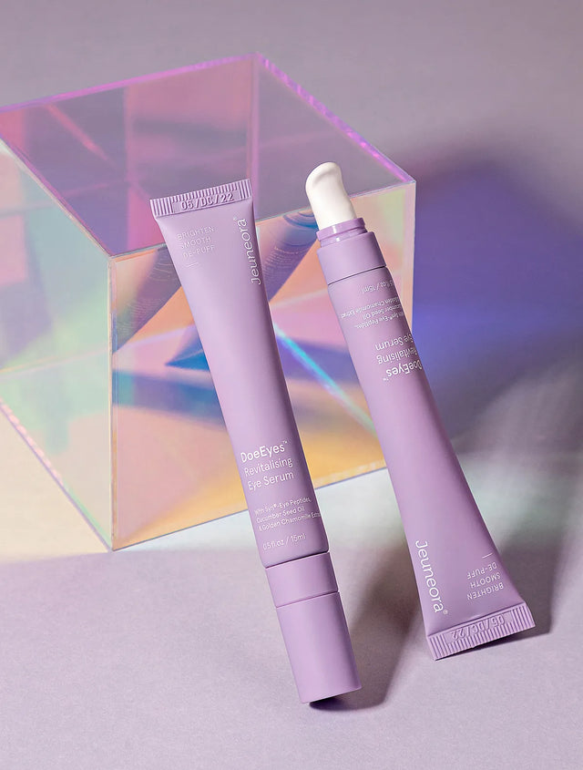 DoeEyes eye serum tubes on holographic cube and purple background