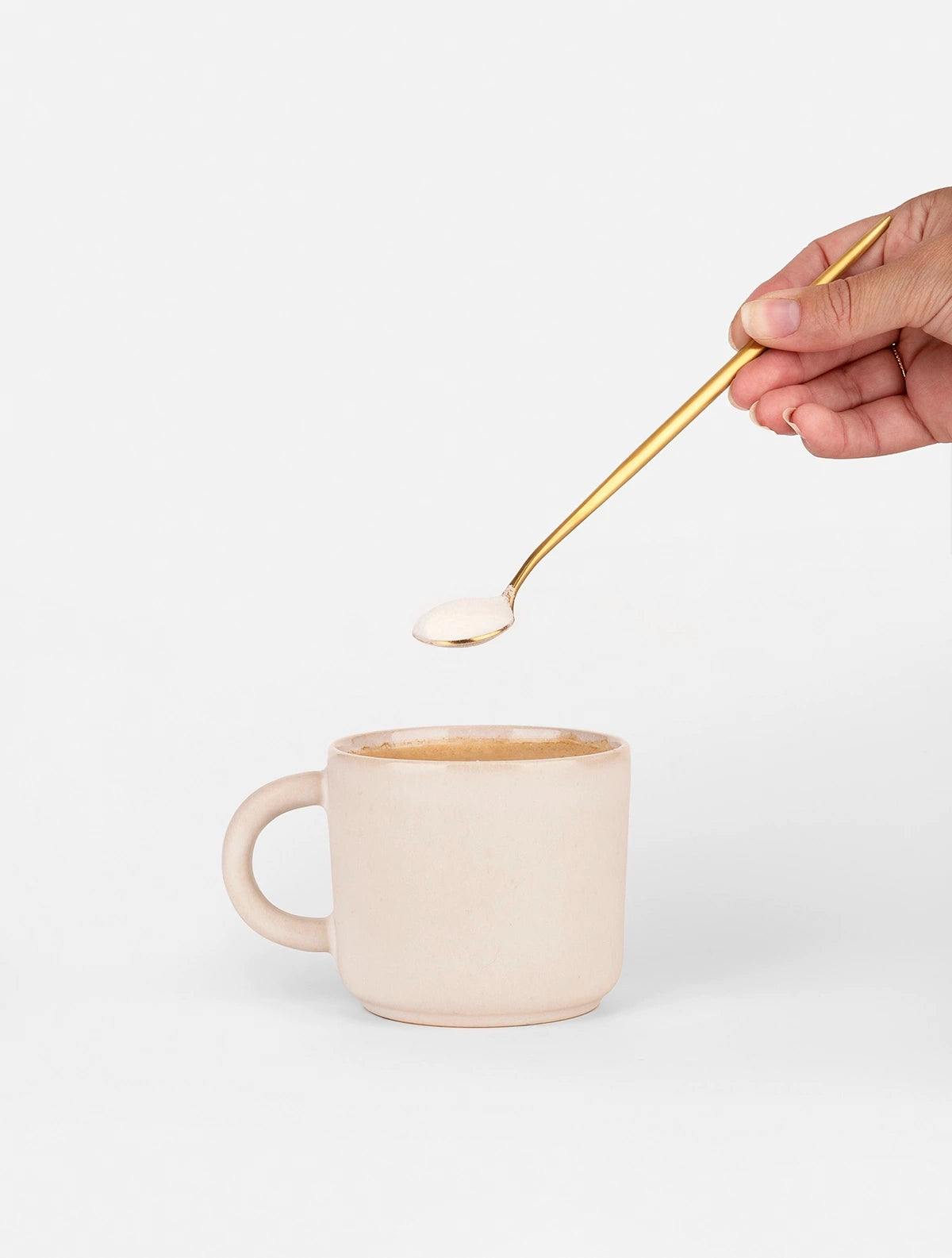 Naked Collagen dropping into coffee